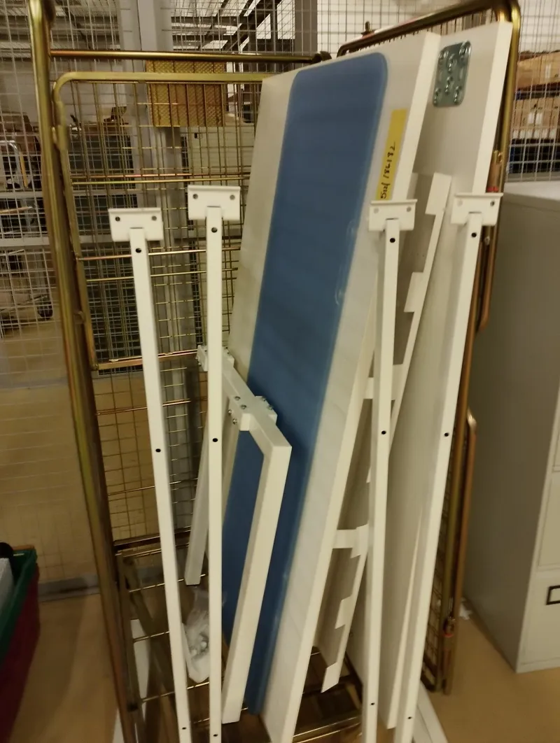 Bank of 2 white desks with dividers.