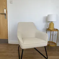 Cream Upholstered Armchair with Black Metal Legs