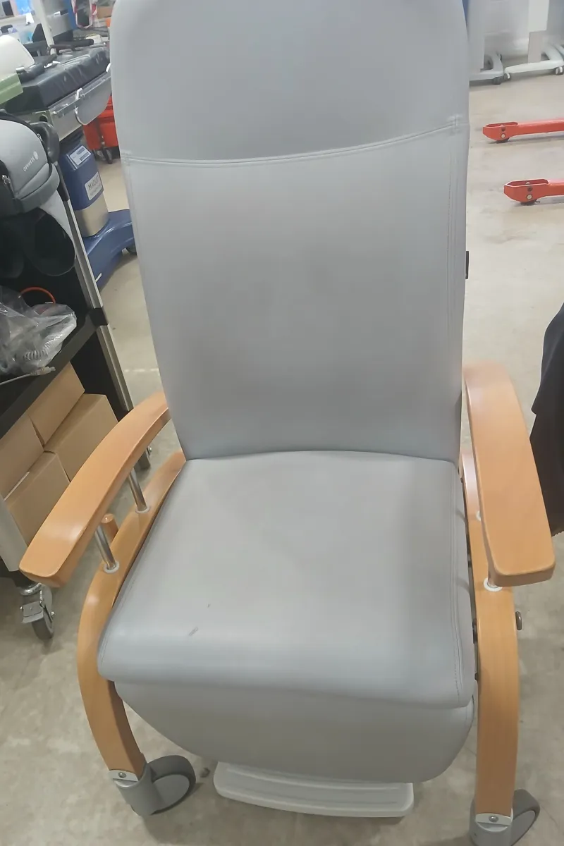 Grey Upholstered Patient Reclining Chair on wheels