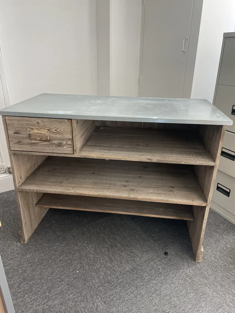 Wooden till/packing bench with drawer and steel top. Height: 90cm Depth: 60cm Width: 47cm - Location Trumpington Street