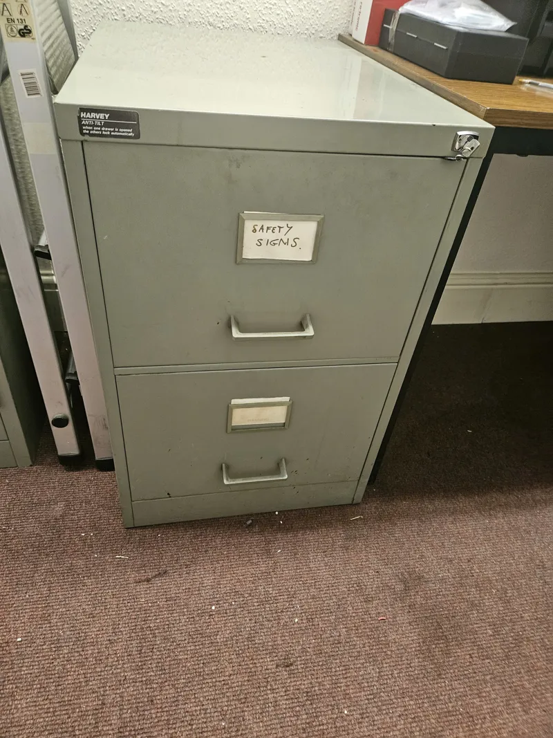 2 drawer filing cabinet with key, grey, top surface corroded.