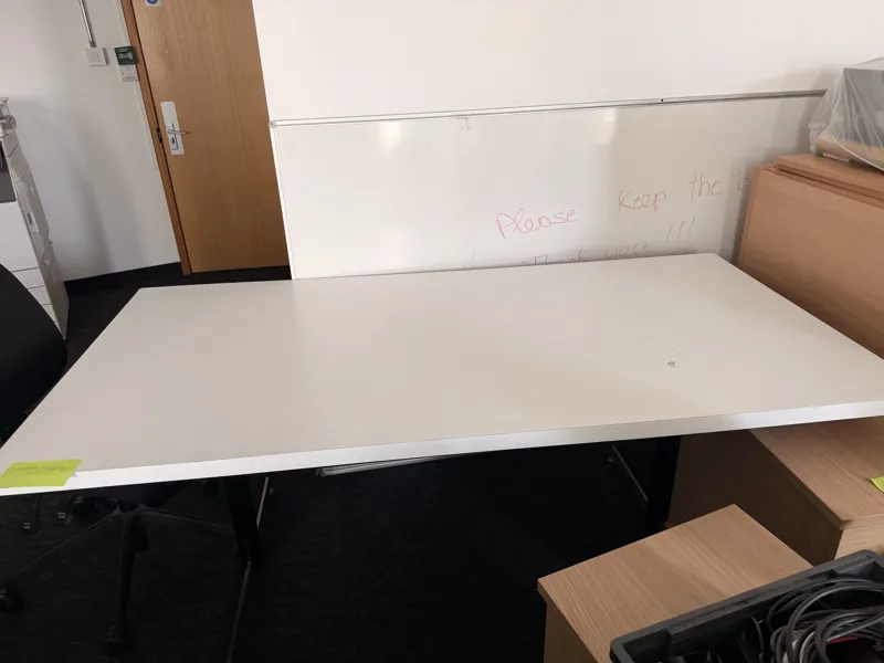 Large white desk with aluminium edging and modesty board