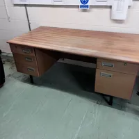 Vintage wooden desk with multiple drawers
