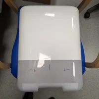 Paper towel dispenser with white casing