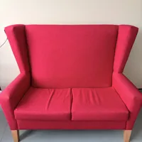 Pink/Red Upholstered Wingback Armchair with Wooden Legs